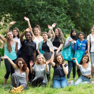 Group of young women waving